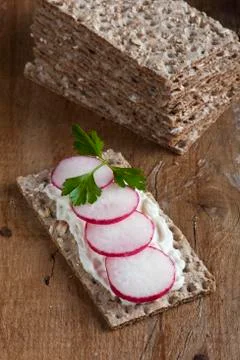 Radishes on crispbread Stock Photos