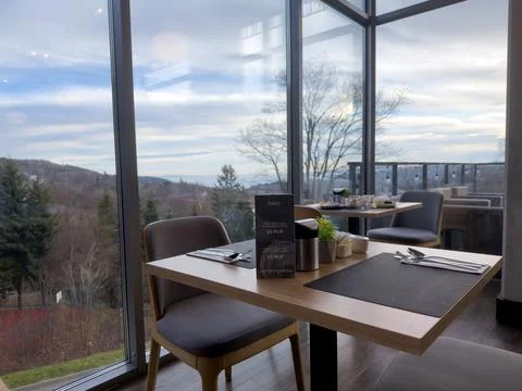 Radisson hotel restaurant table with a mountain view, capturing a modern dining Stock Photos
