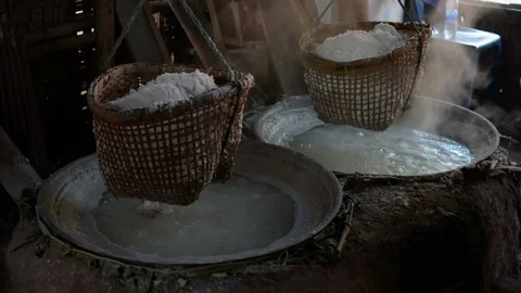Raditional salt making by boiling underground salt water from natural rocksalt p Stock Footage 90837598