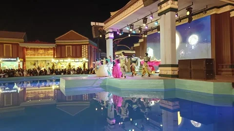 Raditionally dressed dancers perform a Thai dance on stage in Boulevard World Stock Footage 297416388