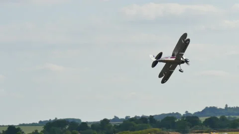 RAF fighter biplane in flight during a reenactment of the Battle of Britain Video stock 155638949
