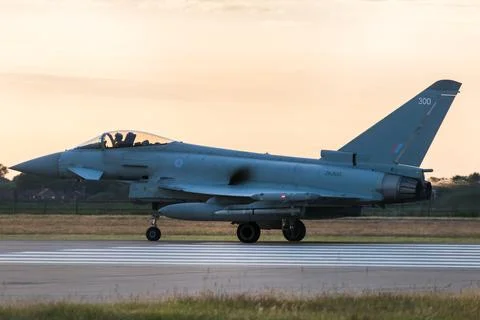 RAF Typhoon prepares to take off at sunset Stock Photos