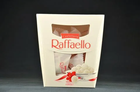 RAFFAELLO candy box on a black background Foto stock