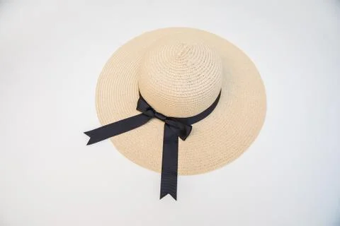 Raffia Straw weaving summer hat with black ribbon on a white background. Stock-Fotos