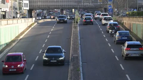 Raffic flow on a busy road in Lisbon Portugal during the day Stock Footage 329896340
