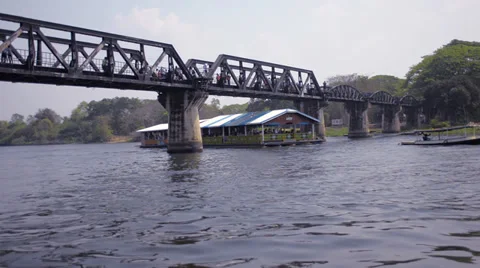 Raft Passing Under the Bridge over the River Kwai in Thailand Stock Footage 36123977