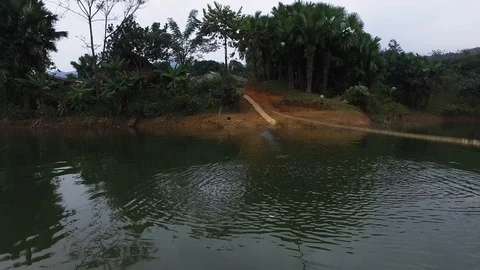 Raft string being pulled at Thac Ba Lake Vu Linh Vietnam, point of view Stock Footage 116526583