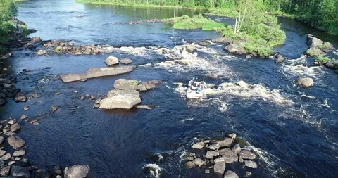 A rafting boat goes down the rapids on a river. Stock Footage 115309007