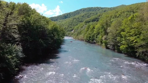 Rafting on a catamaran on a mountain river. View from quadrocopter. Stock Footage 97627982
