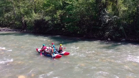 Rafting on a catamaran on a mountain river. View from quadrocopter. Stock Footage 97627996