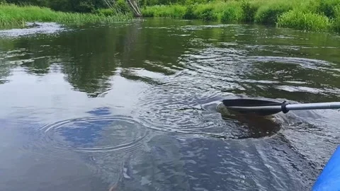 Rafting on the river. They work with an oar, lower it into the water. Stock Footage 234887416