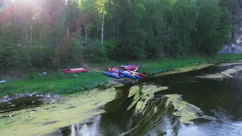 Rafting on the small river Catamarans moored on the ground Stock Footage 246581250