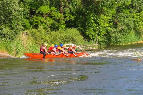 Rafting tourists with an experienced instructor on the river southern bug Stock Photos