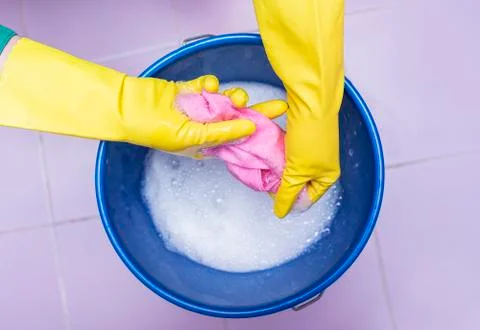 Rag in a bucket of soapy water. Stock Photos