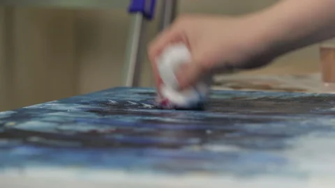 With a rag on canvas smeared paint Stock Footage 113786843