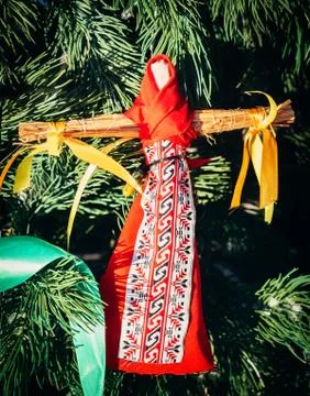 Rag Dolls on christmas tree on folk Slavic pagan holiday Maslenitsa of the end Stock Photos