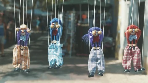 Rag dolls hang in a row on a rope Stock Footage 83322601