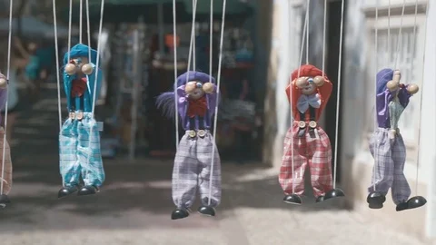 Rag dolls hang in a row on a rope Stock Footage 84234161