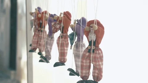 Rag dolls hang in a row on a rope Stock Footage 84234479