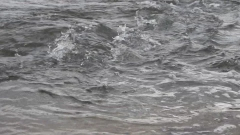 Raging clean fresh mountain river flowing between rocks in slow notion . Video stock 94109828