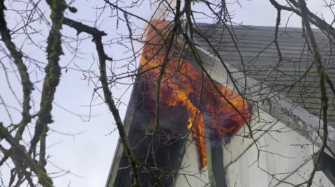 Raging fire burns in upper story window Stock Footage 60795703