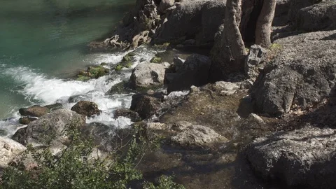 The raging flow of a mountain river Stock Footage 104827537