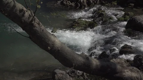 The raging flow of a mountain river Stock Footage 104834370