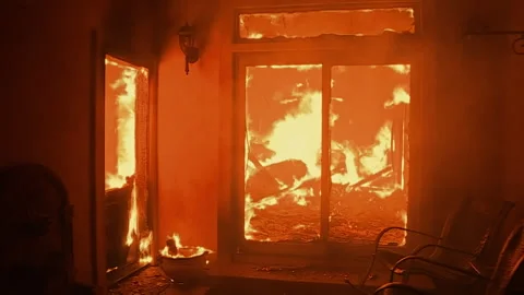 Raging house fire seen from inside burning room 스톡 동영상 332962968