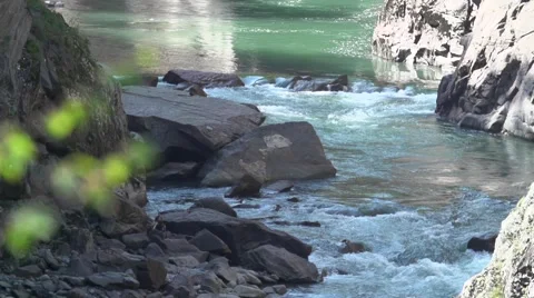 The raging mountain river flows on a canyon between stones rapids Video stock 55525096