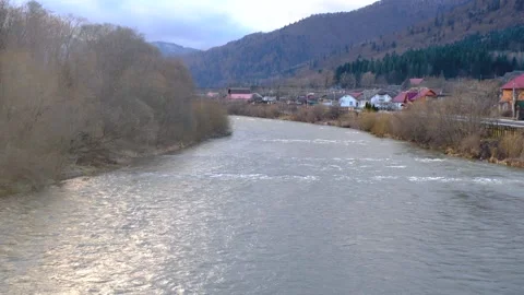 Raging mountain river. Full mountain river. The water is seething on the river Stock Footage 263731281