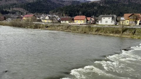 Raging mountain river. Full mountain river. The water is seething on the river Stock Footage 270188897