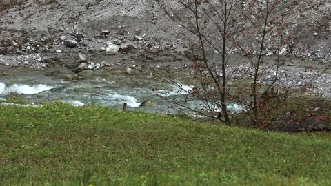 Raging mountain river slow motion Stock Footage 97872542