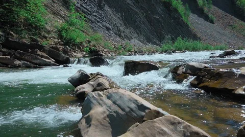 Raging Mountain river. Wildness of clean, clear water in the mountain river Stock Footage 90450648