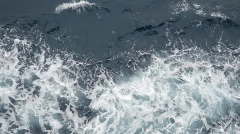 Raging ocean water behind a ship board Видео 54898338