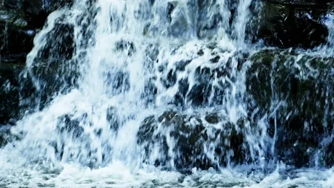 Raging rapids waterfall forcing down on the edge of the rock. Crystal clear Stock Footage 234947624