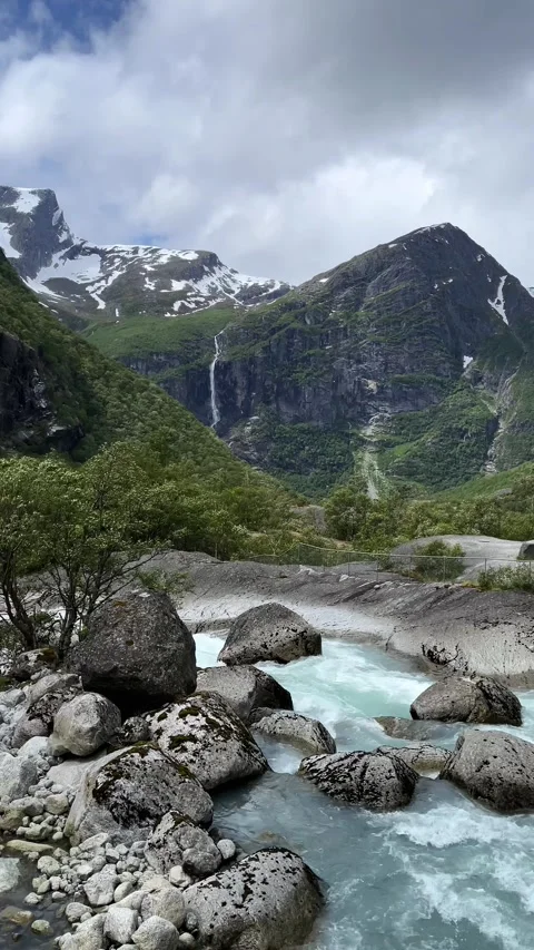 A raging river among the rocks and mountains Stock Footage 337364955