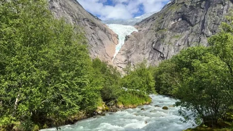 Raging river briksdalsbreen glacier Stock Footage 337364560