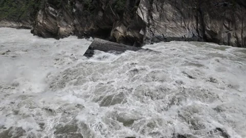 Raging River in Gorge with Huge Rock Slab and Cliffs Stock Footage 340130167