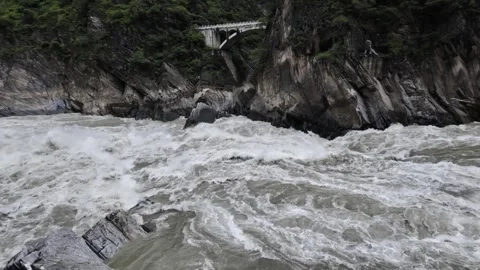Raging River in Tiger Leaping Gorge with Arch Bridge and Stone Tiger Stock Footage 340130469