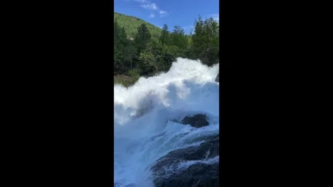 A raging river waterfall in Geiranger Stock Footage 337364517