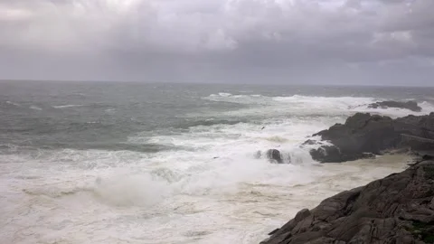 Raging Seas: The Symphony of Waves on a Rocky Shore Stock Footage 264162068