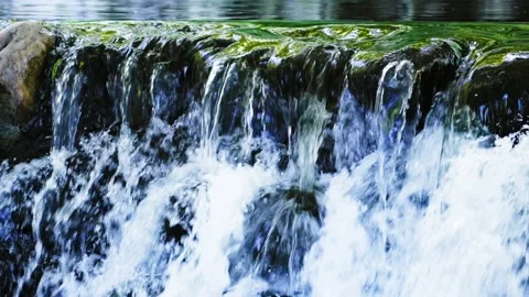 Raging waterfall flowing over the rocks Stock Footage 235785728