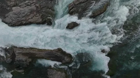 Raging Waterfall Over Dark Rocks in Narrow Gorge Stock Footage 310613512