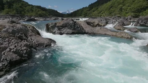 Raging Waterfall Over Dark Rocks in Narrow Gorge Stock Footage 310614036