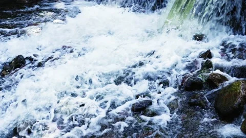 Raging waterfall splashing on rocks Stock Footage 235784214