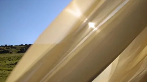 Rags developed in the wind on the background sun and sky Stock Footage 76298243