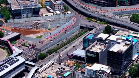Raidurg metro track edge with mindspace entrance, buildings, underpass Stock Footage 345618977