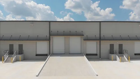 Rail camera view, left to right, of a modern light industrial office 動画素材 116983656