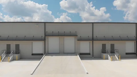 Rail camera view, right to left, of a modern light industrial office 動画素材 116983651