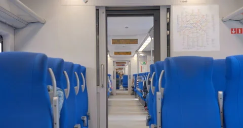 Rail cars of the ground metro while driving, few passengers Stock Footage 119634227
